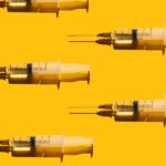 pattern-of-syringes-with-a-vaccine-on-yellow-royalty-free-image-1714391156.jpg